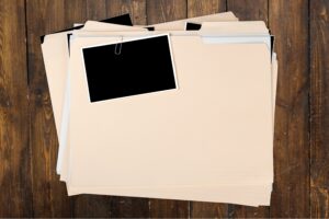 Manila folder with blank picture attached by paperclip